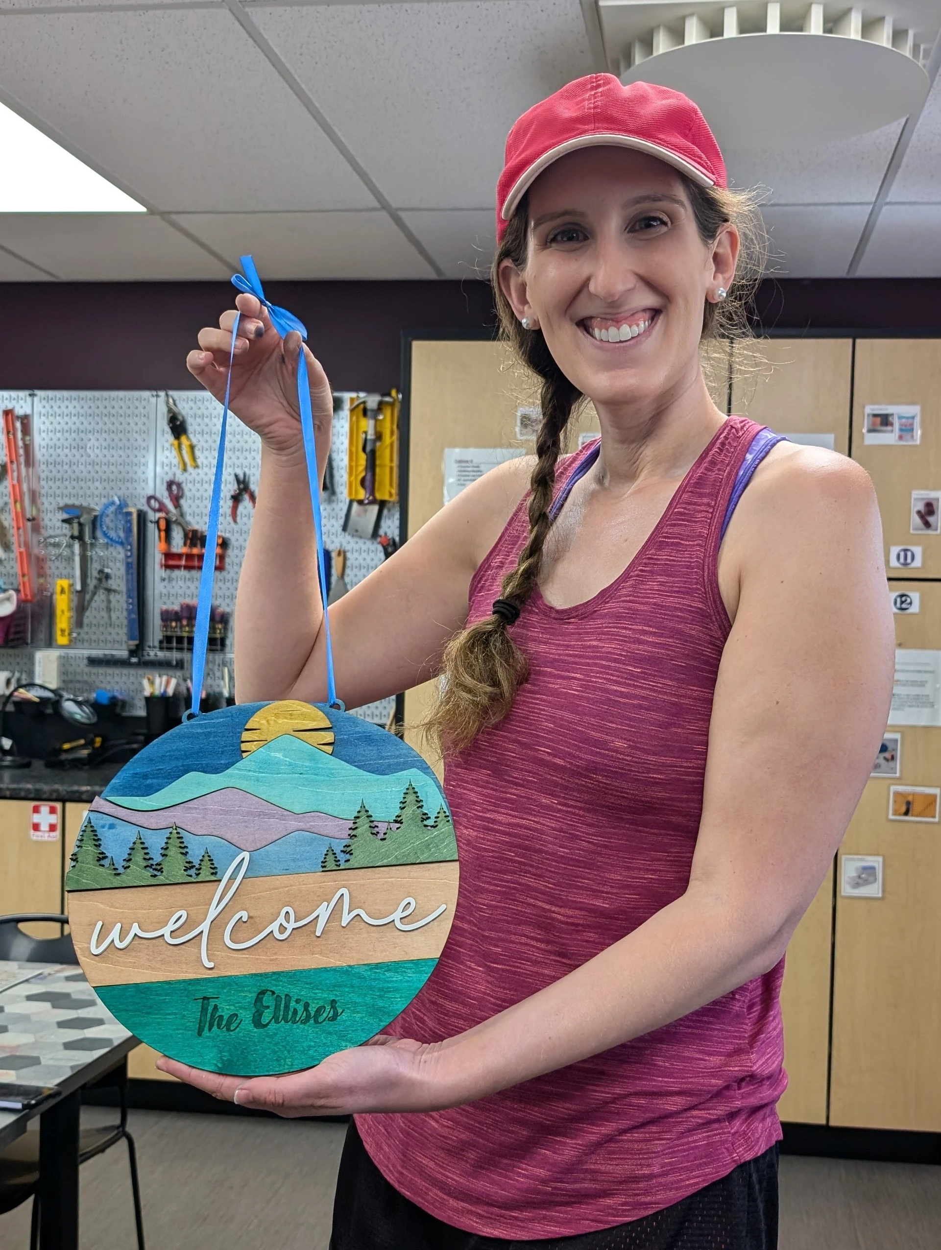 Woman holding a laser engraved sign