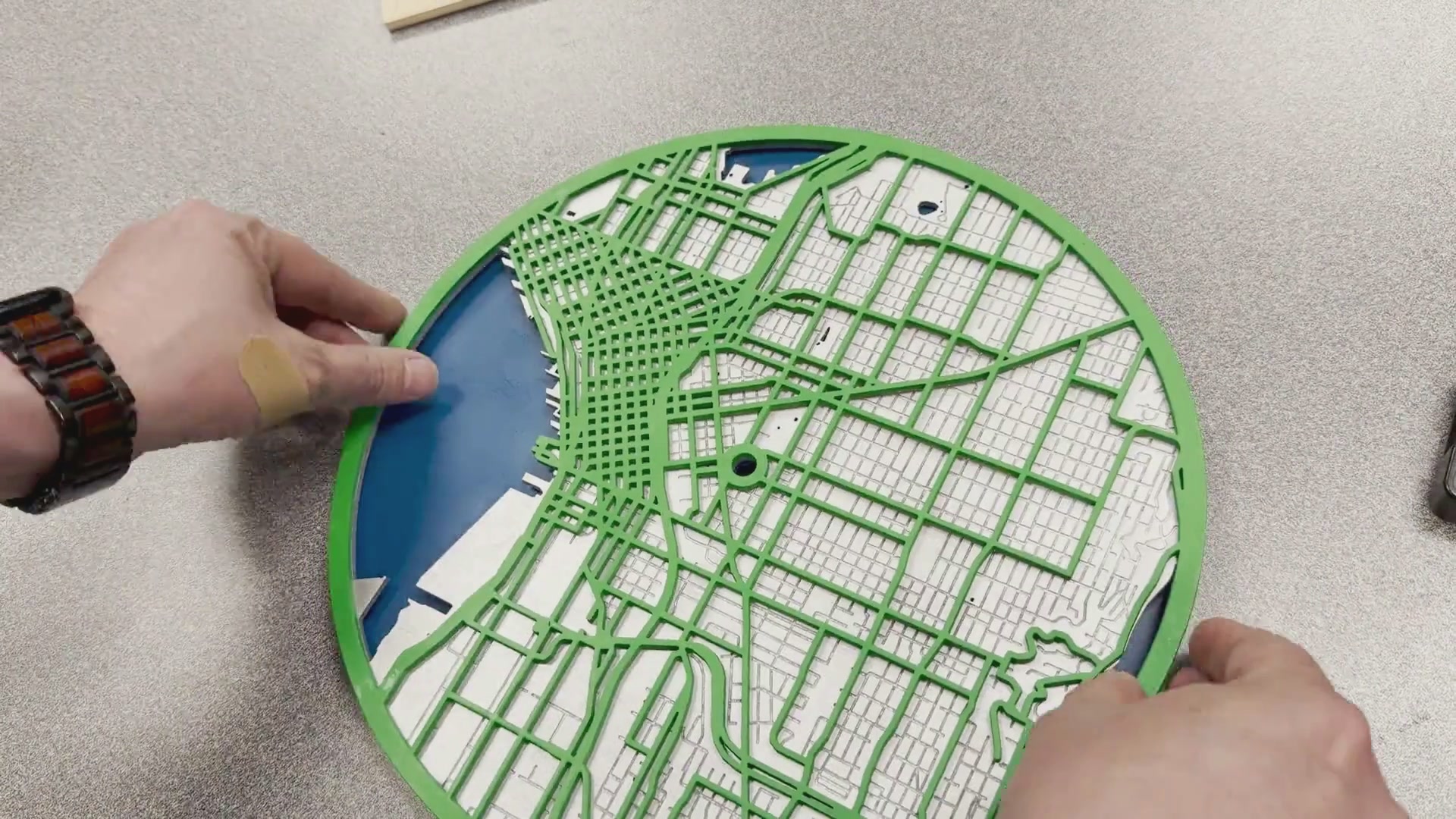 Assembling laser cut city map clock