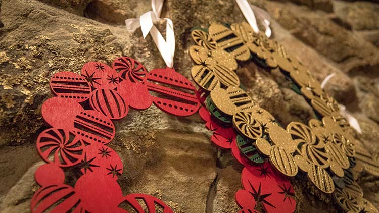 Close up of laser cut Christmas wreaths.