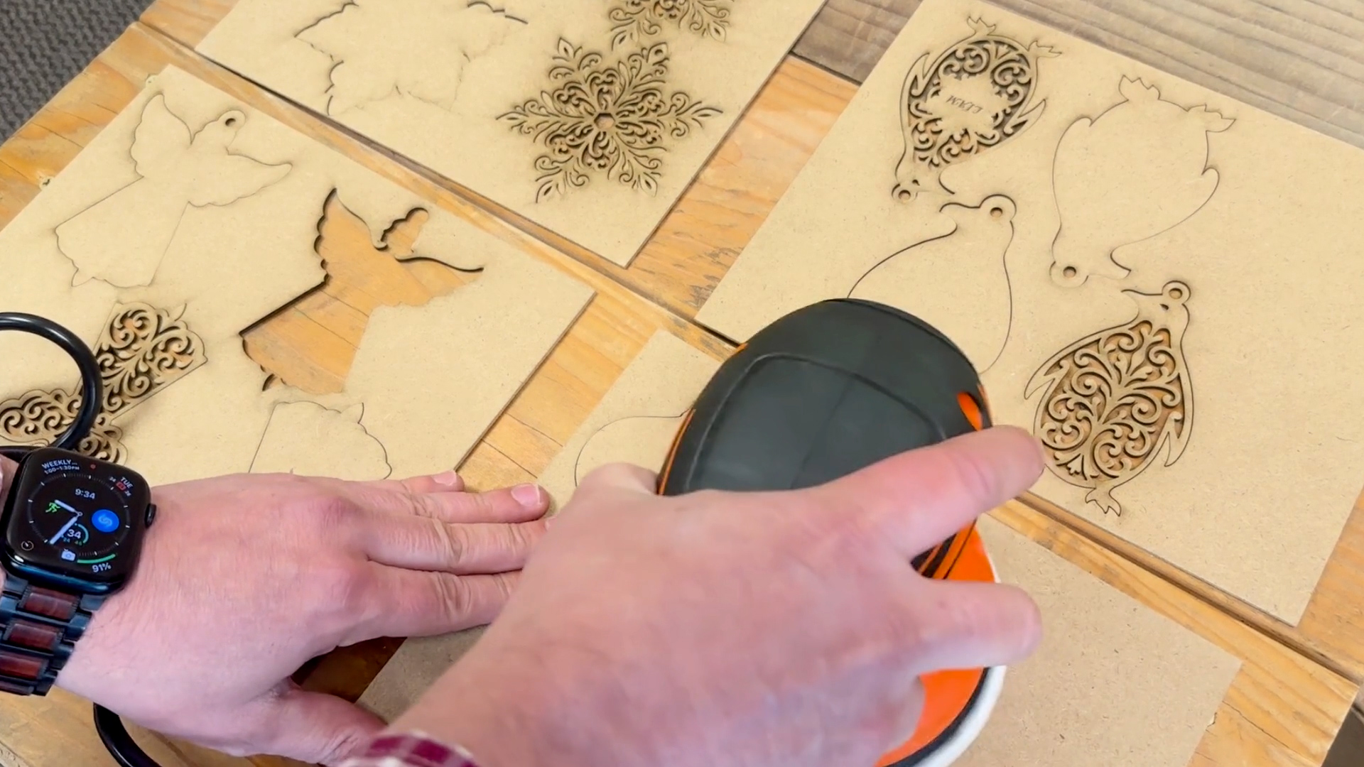 Sanding wooden laser cut Christmas ornaments