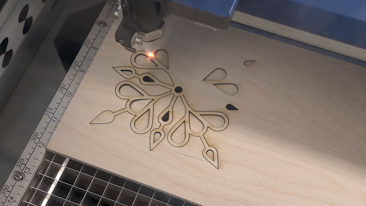 Laser cutting sheet of plywood