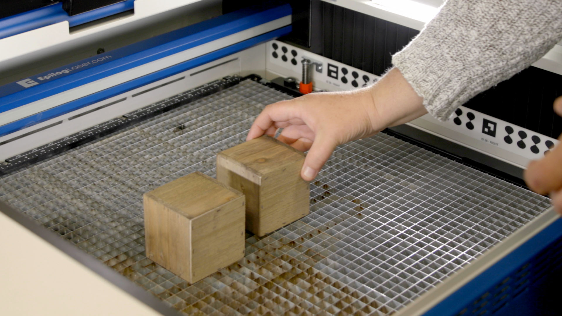 Placing wooden planter box in laser machine