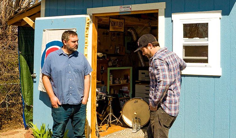 Jeremy Brieske and Chris Gregori standing outside the Low Boy Custom Beaters workshop.