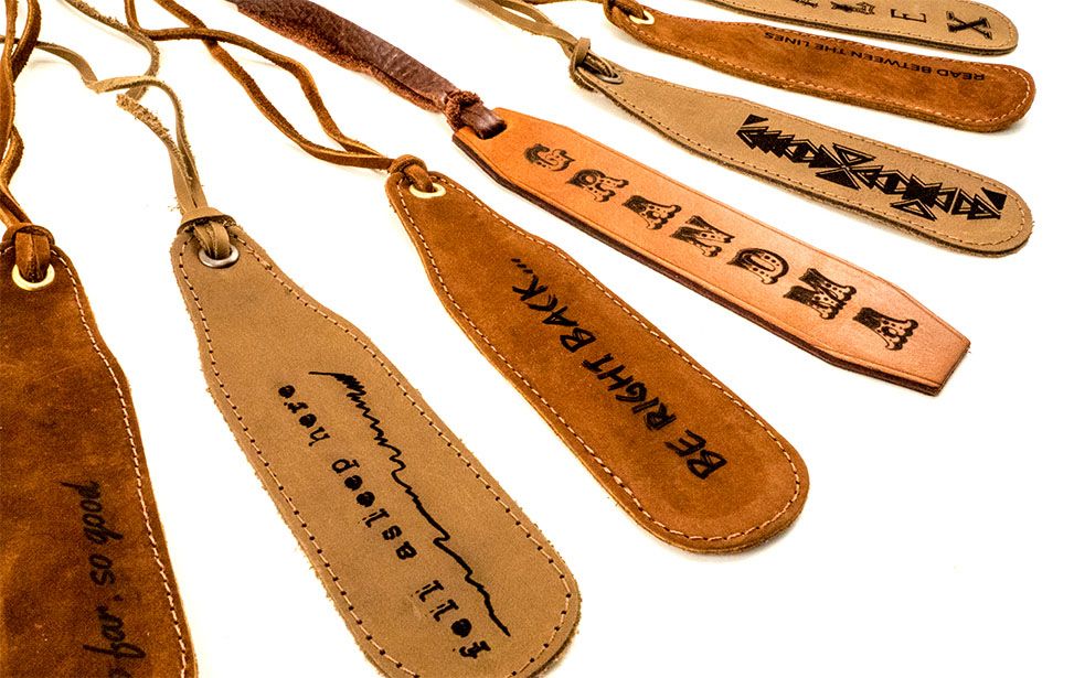 An assortment of leather bookmarks engraved with a laser