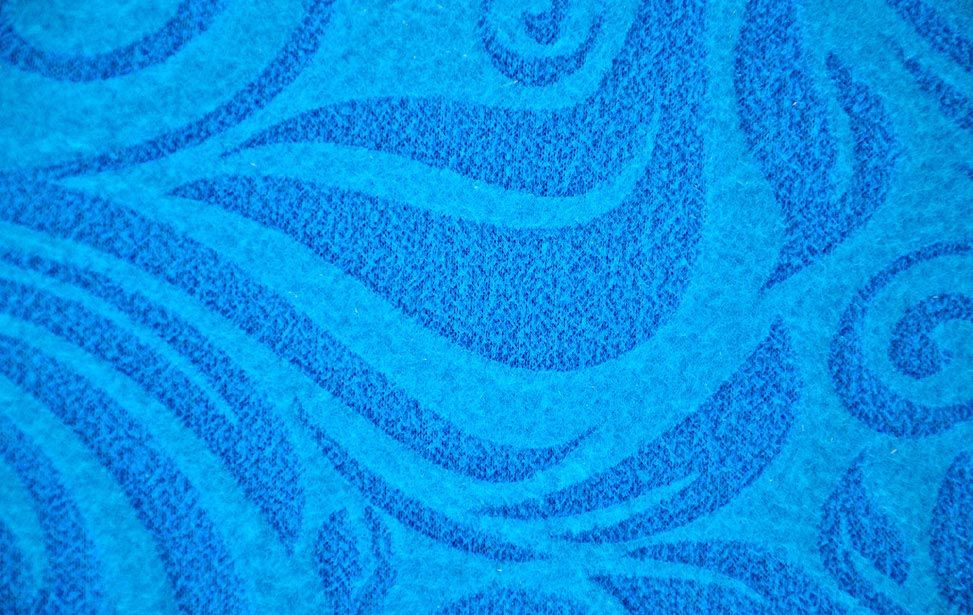 Close-up de um padrão de lã azul gravado a laser