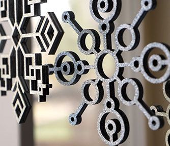 Laser cut plywood snowflakes