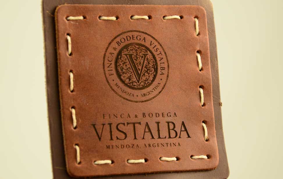 Laser engraved logo on a leather coaster