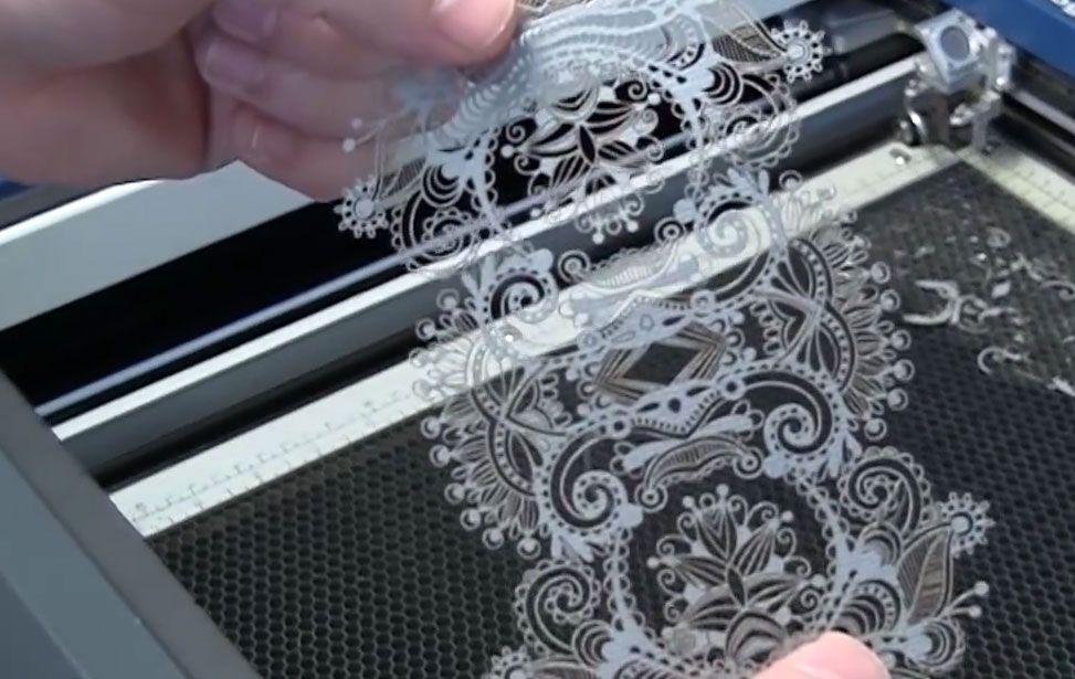 laser cutting intricate paper invitation